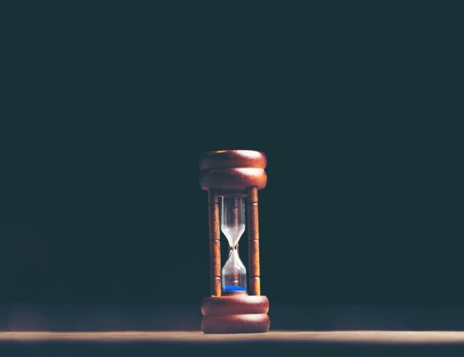 hourglass on black background